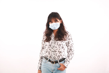 Woman wearing stylish protective face mask, posing on white background.