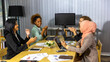 © Ron - Business women from different ethnic races and cultures working together in an office for business development or plan
