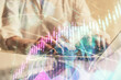© peshkova - Double exposure of woman hands typing on computer and forex chart hologram drawing. Stock market invest concept.