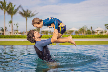 Father and Son having fun in the swimming pool