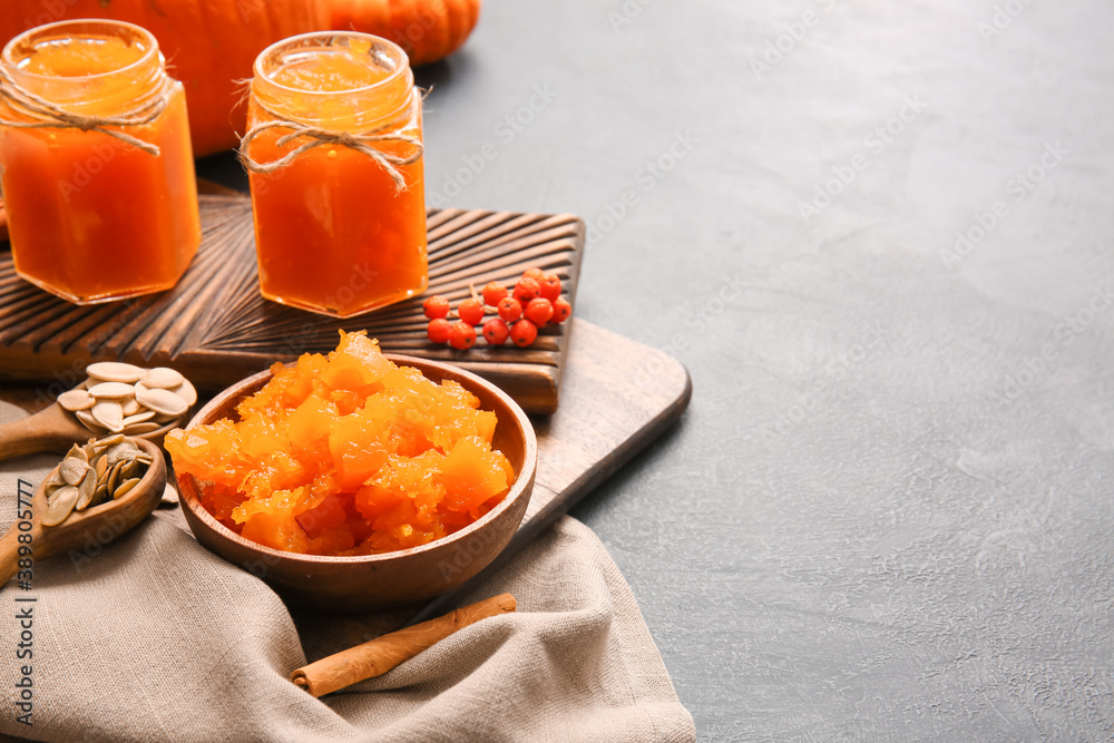 Tasty pumpkin jam on dark background