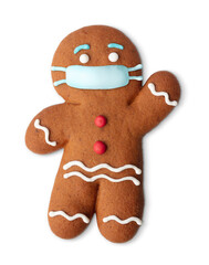 Classic gingerbread cookie man with medical mask isolated on white