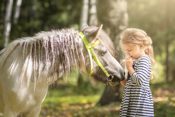 little blond girl with pony