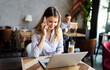 © NDABCREATIVITY - Beautiful brunette coworker businesswoman talking on mobile phone
