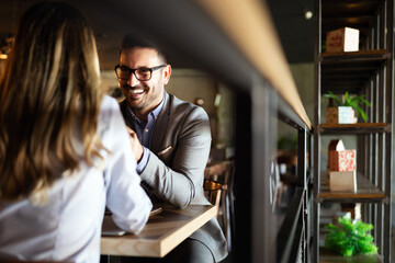 Wall Mural - Attractive elegant young couple in love dating at the restaurant.