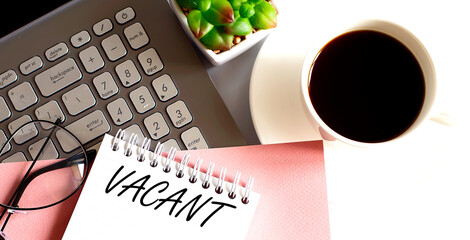 Poster - Office supplies, devices, coffee cup and glasses on white table with text VACANT
