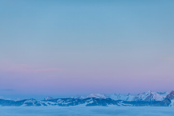 Naklejka na meble Splendid apline scenery. High mountains with fog and lovely evening light.