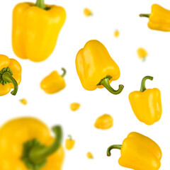 Wall Mural - Many yellow bell peppers free falling on white background. Selective focus - shallow depth of field.