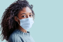 African American Girl Wearing Face Mask On Background