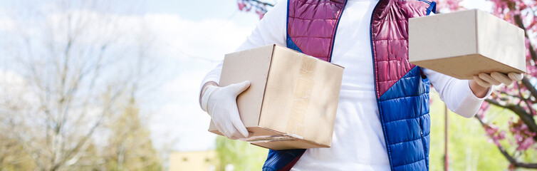 Sticker - Grocery delivery man wearing medical gloves and face mask. Online shopping and delivery for grocerys, wine and food. Self Quarantine during coronavirus pandemic. Food delivery service courier