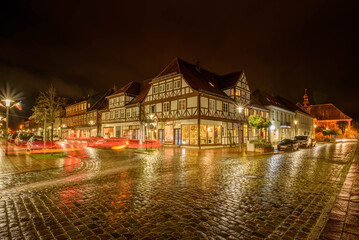 Panorama view of half-timbered houses on the Paradeplatz in Rendsburg at night.