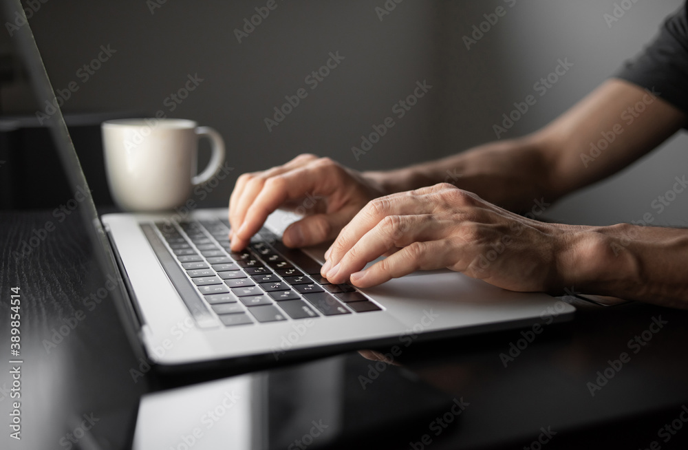 Businessman or student using laptop at home, Man hands typing on computer keyboard closeup, online learning, internet marketing, working from home, office workplace freelance concept - obrazy, fototapety, plakaty 