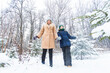 © satura_ - Parenting, fun and season concept - Happy mother and son having fun and playing with snow in winter forest