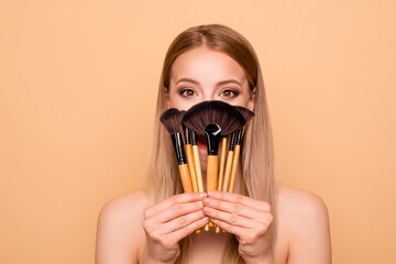 Wall Mural - Portrait of dream dreamy cunning curious youth person hold hand blusher have style feel positive cheerful satisfied candid content excited she isolated on beige background