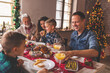 © Impact Photography - Family eating Christmas dinner