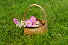 Basket With A Poem Book And Pink Flowers