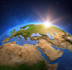 Wall Mural - surface of the planet earth viewed from a satellite, focused on europe and middle east, sun rising o