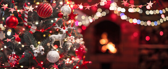 Wall Mural - christmas tree with decorations near a fireplace
