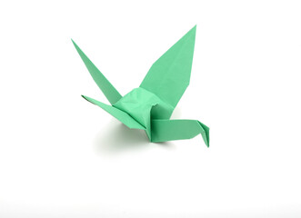 Wall Mural - A green origami bird, top view