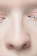 © master1305 - Nose and eyelid. Close up portrait of beautiful albino female model. Parts of face and body. Beauty, fashion, skincare, cosmetics, wellness concept. Copyspace. Well-kept skin, fresh look, details.