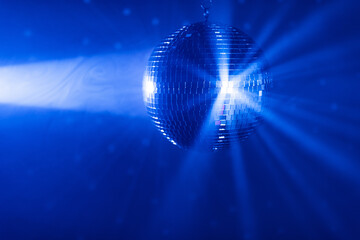 Wall Mural - disco ball background with blue shiny rays