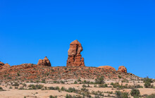 Tall Rock Formation Against Blue Sky In Arches National Park