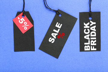 Wall Mural - Sale tags with text Sale, Black Friday, five percents on blue background