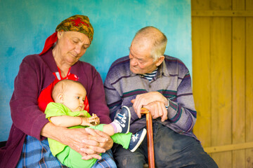 Wall Mural - Portrait of a very old couple at country side smiling and having fun.