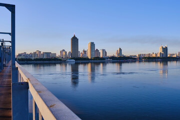 Wall Mural - A view of skyscrapers on the banks of the Songhua River in Harbin, China