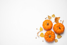 Composition With Pumpkins And Autumn Leaves On White Background, Top View