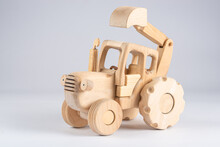 Wooden Kids Excavator Tractor Toy Isolated On White Background, Close View 