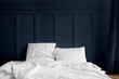 © Rawpixel.com - White bed linen on a mattress in a midnight blue bedroom