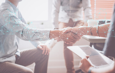 Wall Mural - Business people shaking hands for greeting