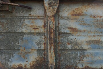 Wall Mural - metal texture from old dirty gray iron wall in brown rust with seam