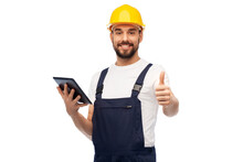 Profession, Construction And Building - Happy Smiling Male Worker Or Builder In Yellow Helmet And Overall With Tablet Pc Computer Showing Thumbs Up Over White Background