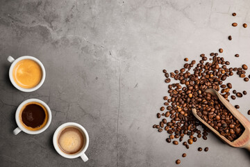 Wall Mural - Variety of coffee cups top view with beans on stone table