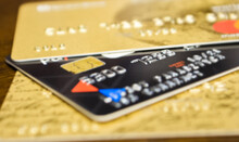 Close-up Of A Three Credit Cards Located On A Table 