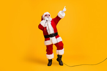 full length photo of crazy overweight santa claus sing microphone christmas x-mas song on noel party