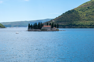 Wall Mural - Island on coastal side of Kotor on sunny day. Kotor,Montenegro