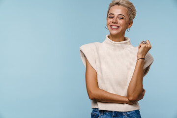 Happy beautiful blonde girl smiling and looking at camera