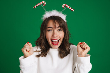 Sticker - Beautiful excited girl wearing toy horns screaming and looking at camera