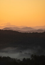 USA, Georgia, Orange Sky Above Blue Ridge Mountains At Sunrise