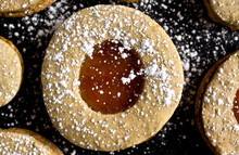 Close Up Of Pistachio Linzer Cookies With Orange Marmalade