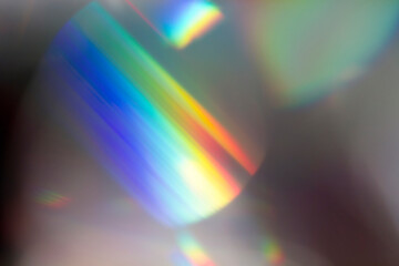 Wall Mural - colourful lens flare and haze on black background.