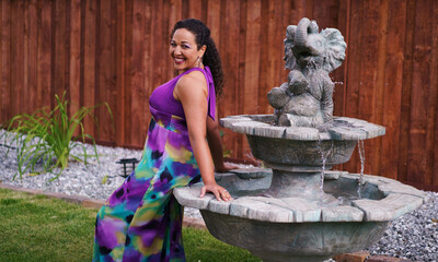 Beautiful biracial woman in garden in backyard