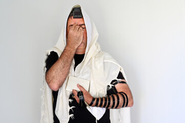 Wall Mural - Jewish man praying with Tallit and Tefillin