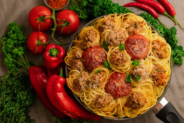 Poster - Closeup shot of spaghetti with meat and tomatoes surrounded by legumes and vegetables