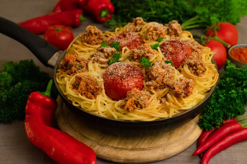 Poster - Closeup shot of spaghetti with meat and tomatoes surrounded by legumes and vegetables