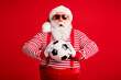 © deagreez - Portrait of his he nice handsome attractive amazed stunned Santa grandfather holding in hands ball playing match amateur league isolated bright vivid shine vibrant red color background