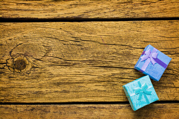 Christmas background with blue gift boxes on a wooden board